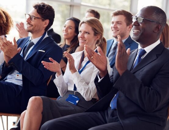 Smiling,Audience,Applauding,At,A,Business,Seminar