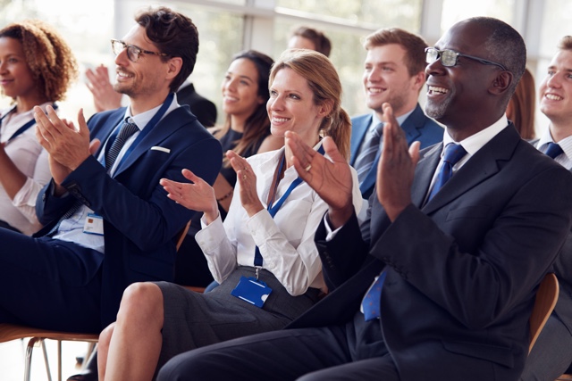 Smiling,Audience,Applauding,At,A,Business,Seminar